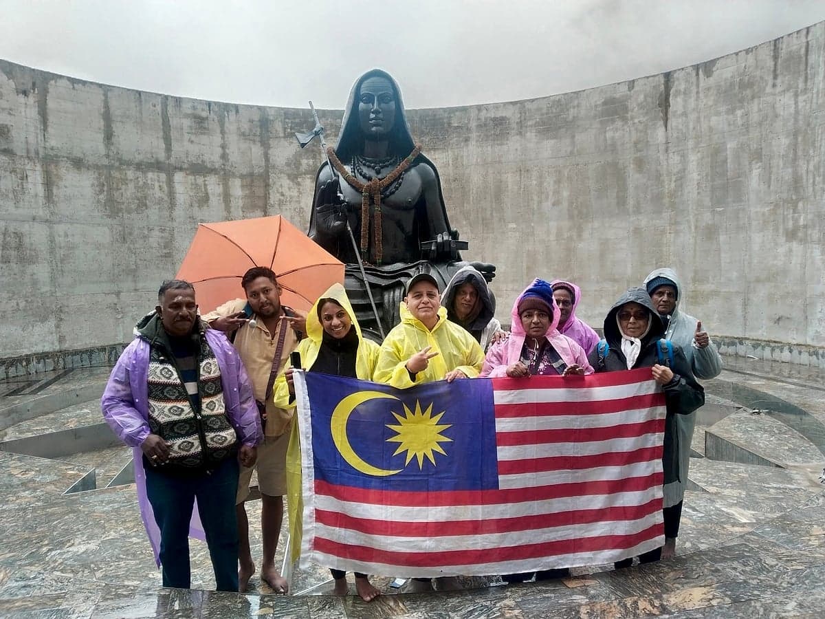 With a visiting group at a Shiva statue in Nepal